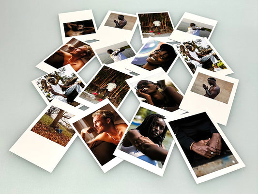 16 vibrant pigment printed A6 House Textured 100% Cotton Rag 320 gsm fine art artist cards on a blue desk